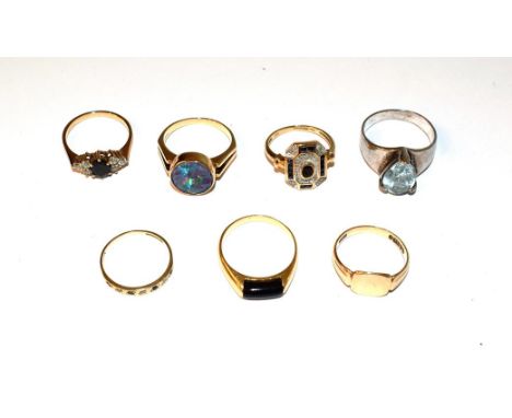 A 9 carat gold signet ring, finger size N; a 9 carat gold sapphire and diamond ring, finger size L; and a 9 carat gold sapphi