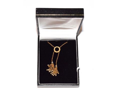 A seed pearl necklace with tassel drop detail, stamped '15CT', length 43cm .  Gross weight 4.5 grams. 