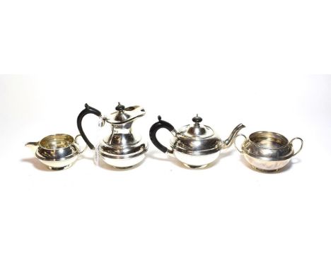 A four-piece Edward VII and George V silver tea-service by Carrington and Co., London, the cream jug 1908, the sugar bowl 190