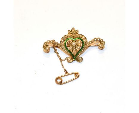 A seed pearl and green enamel brooch, stamped '15CT' (one seed pearl lacking), length 4.2cm .  Gross weight 7.02 grams. 
