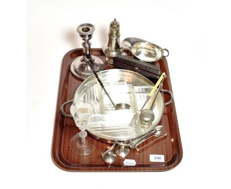 A group of assorted silver and silver plate, the silver comprising: a caster, a sauce boat, two differing pairs of sugar tong