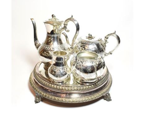 A Victorian silver plate mirrored plateau, with foliage cast border, 28cm diameter together with a four-piece Victorian silve