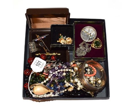 A collection of jewellery including a cultured pearl necklace, beaded necklaces, an enamel brooch, other brooches, a hat pin 