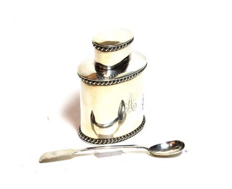 A silver tea caddy and a silver spoon (2)  