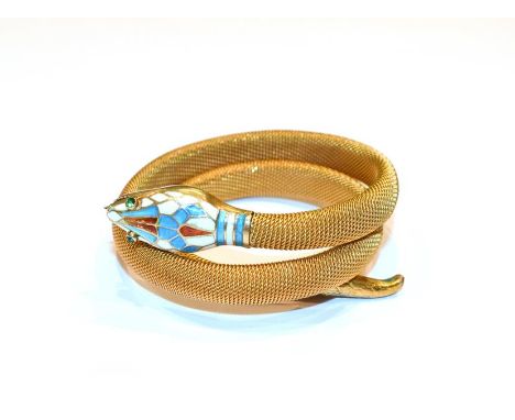 An enamel snake bangle, with paste set eyes.  The bangle is gilt metal. Gross weight 22.8 grams. 