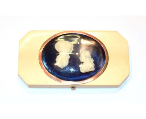 A Russian ivory patch-box, oblong and with cut corners, the hinged cover set with portrait busts of Catherine the Great and P