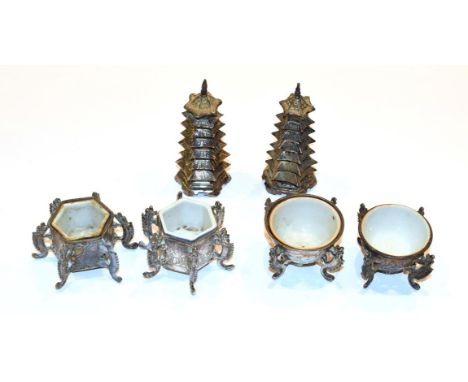 Two pairs of Chinese export silver saltcellars, each with ceramic liner, together with a pair of Chinese export silver pepper