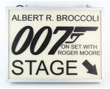 James Bond - Metal lightbox 'Albert R. Broccoli 007 Stage on set with Roger Moore', Perspex front with metal casing, measures