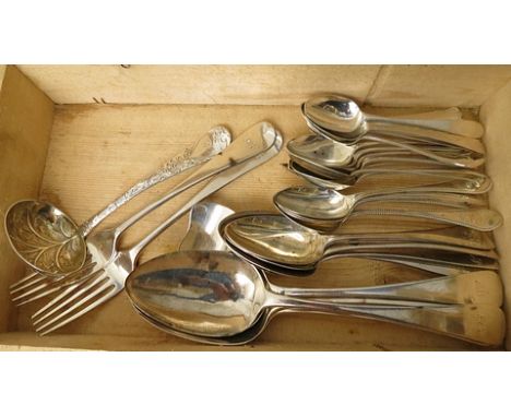 Four Georgian silver basting spoons, four pudding spoons, eighteen teaspoons, two forks, caddy spoon and sauce ladle