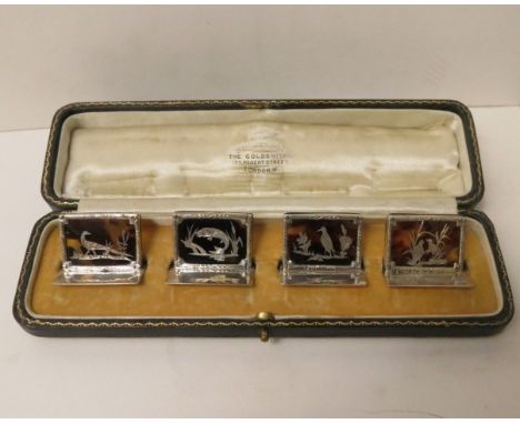 Set of four George V1 silver and tortoiseshell menu holders in a Wilson & Co box, each depicting a game bird or a leaping sal