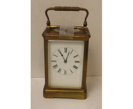 A French 19th century Henri Jacot gilded brass carriage clock with repeat button striking on the hour and half-hour on a gong
