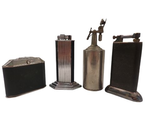 Four table lighters, comprising a Mc Murdo Slumberland lighter, a chrome bottled lighter, one stamped DP with Mercedes Benz l