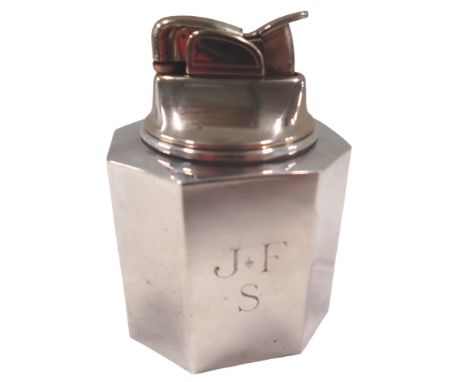 An Evans USA table lighter, of octagonal form, bearing the initials JFS, white metal stamped weighted sterling, 8cm high.