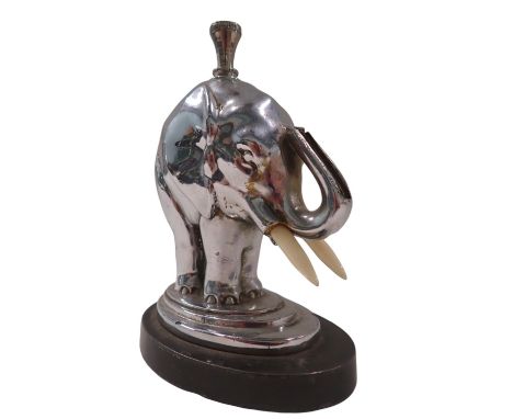 A 1950s/60s chrome table lighter, formed as an elephant on circular foot, stamped AMV Works 1935, 12cm high, 9cm diameter.
