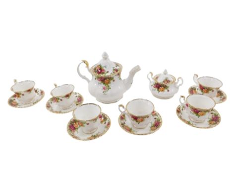 A Royal Albert Country Roses pattern service, comprising teapot, six cups and six saucers, and sugar basin with cover.
