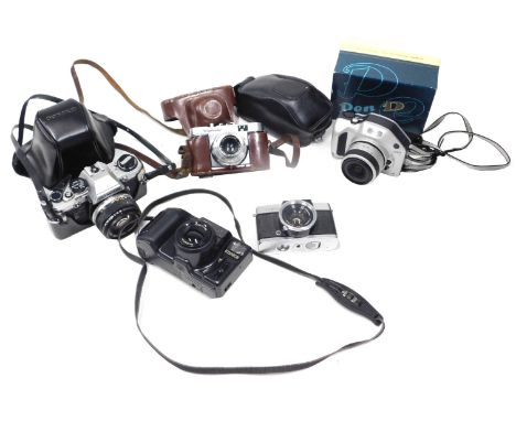 A group of cameras and camera equipment, comprising a Konica Z/UP 80RC a Nikon Pronea S, a Voiglander Vito B, a boxed Olympus