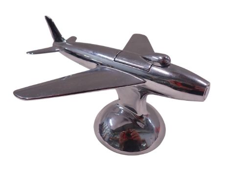 A Dunhill table lighter, in the form of an airplane, signed J Hennick, 9cm high, 16cm wide.