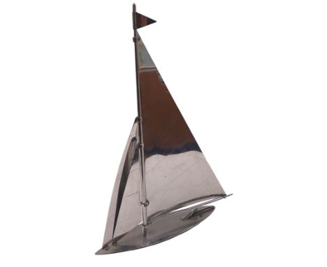 A Parker Yacht lighter, the masted top with chrome decoration, with a blackened base, 35cm high, 20cm wide, and 4cm deep.