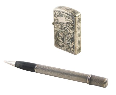An engine engraved cased pocket lighter, of flower design with a vacant crest, unbranded with flip top, in a Capini &amp; Co 