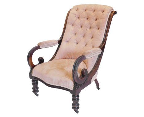 A mahogany framed button back upholstered arm chair, with high scrolling back, and open scroll arms, with padded rests, uphol