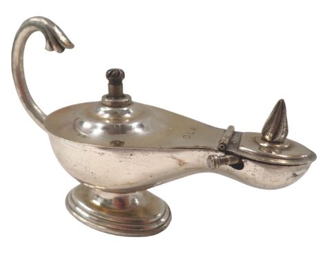 A Dunhill London Aladdin's lamp table lighter, inscribed OLA, 11cm high, 14cm wide, 6cm deep.