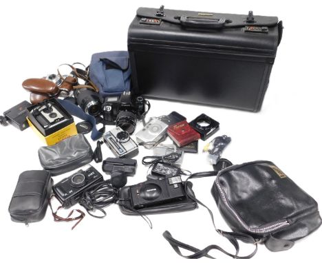 A leather briefcase and contents of cameras and camera equipment, comprising a Canon EOS 1000F camera, a Canon zoom lens 75-3