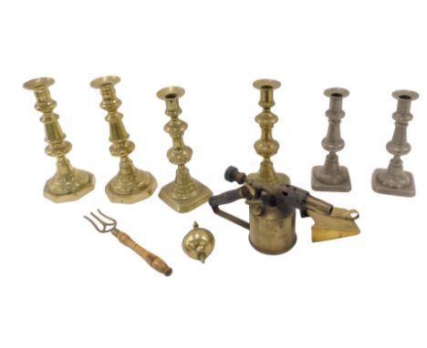 Brass candlesticks and blowtorch, etc., comprising various brass candlesticks, clock ball ornament, three pronged fork, etc. 