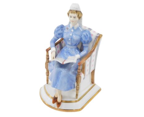 A Royal Worcester porcelain figure of Sister of The London Hospital, modelled by Ruth Van Ruyckevelt, circa 1963, model numbe