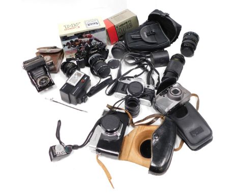 A quantity of cameras and camera equipment, comprising Canon AI, with Canon Macron lens FD 50mm, various lens caps, a SCA310 