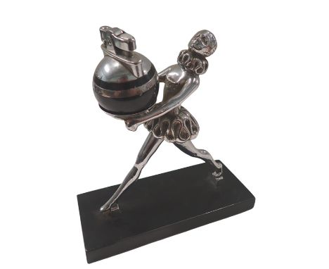 1950s/60s lighter, formed as a figure with ruffed collar, on a black metal base, with orbed lighter, 17cm high, 16cm wide, 7c