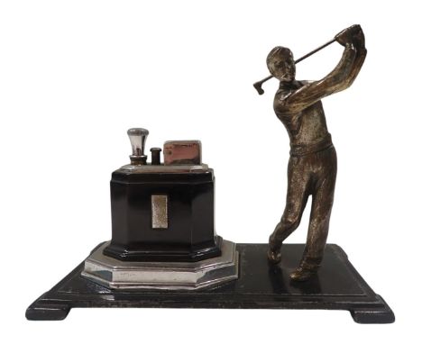 A Ronson Art Deco table lighter, formed as a male golfer, on black metal base, with chrome and black lighter, 16cm high, 19cm