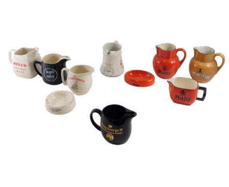 A group of Scotch whisky advertising water jugs, and ashtrays, including Haig, Bell's, Glenfiddich, Black &amp; White, etc. (