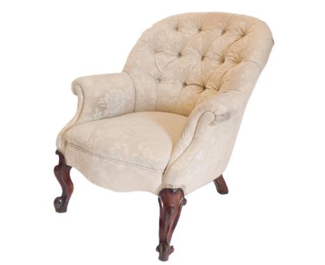 Two Victorian button back upholstered arm chairs, in cream upholstery, one with scroll arms, the other with French cabriole l