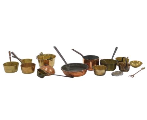 A collection of brass and copper, including brass saucepans, copper saucepan, brass jam pan, brass toasting fork, etc.