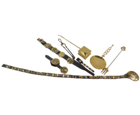 A collection of horse brasses with Martingale straps and other brass, including square chestnut roaster, brass skimmer, toast