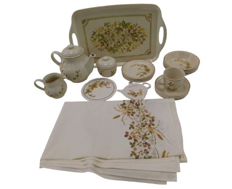 A St Michaels Harvest pattern part tea service, comprising serving tray, teapot, milk jug, sugar bowl, one teacup, teapot sta