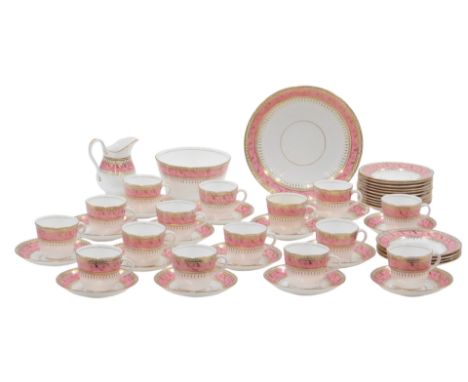 An early 20thC tea service, on a white ground with pink border, picked out in gilt, to include cake plate, milk jug, sugar bo