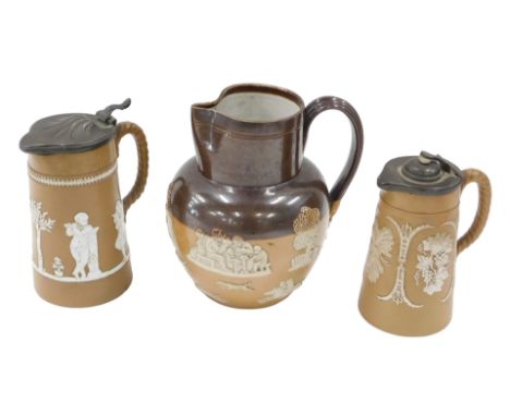 Two Staffordshire lidded stoneware Jasper style relief moulded jugs, one with classical muses, the other with fruiting vine a