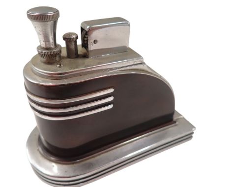A Ronson touch tip Art Deco table lighter, of arched form with imitation tortoiseshell body, with chrome fitments, 10cm high,