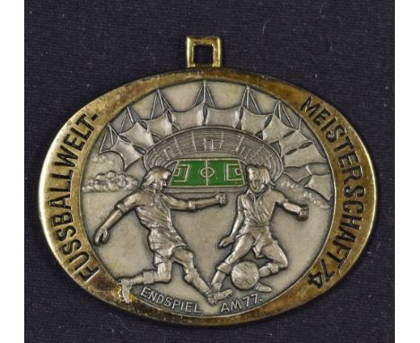 1974 World Cup Finals Commemorative Medal oval shaped, measures 6x4.5cm approx. gold plate surround with enamel pitch to cent