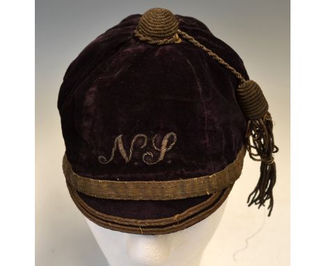 England Rugby Trials Cap -North v South  Rugby Cap, 1891: Maroon velvet six-panel cap with gold braid, 'NS' motif and tassel 