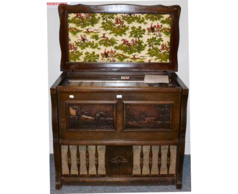 Symphomatic JB120 (Export) Juke Box in wood case with carved relief panels to front and padded cloth hunting scene to inside 