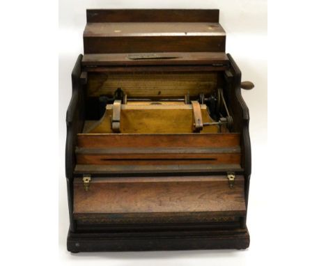 Organette hand cranked with spool for 5'', 20 stop reel, in wooden case marked with ''By Royal Letter Patent', manufacturers 