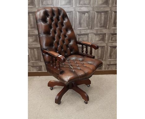 MAHOGANY HIGH BACK SWIVEL BUSINESS ARM CHAIR upholstered button back, arm rests and seat in brown leather, on quadruple scrol