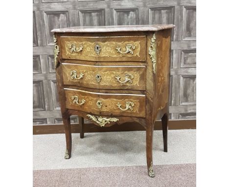 KINGWOOD, FLORAL MARQUETRY AND GILTMETAL MOUNTED BOMBE COMMODE of LOUIS XV DESIGN the rouge marble top with moulded edge, thr