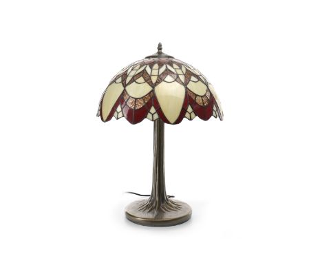 TIFFANY STYLE TABLE LAMPthe domed leaded glass shade, on a bronzed stylised tree trunk base, 60 cm high 