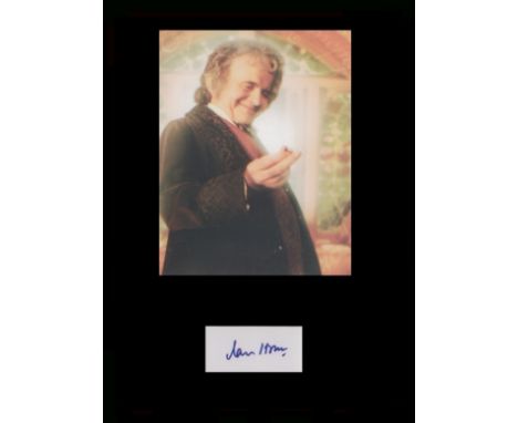 Lord of the Rings - Ian Holm. Signature mounted with picture in character as Bilbo Baggins from The Lord of the Rings. Profes