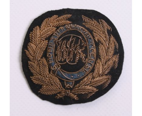 West Indies Regiment Officers Bullion Cap Badge circa 1888-1901, bullion wire wreath with blue garter and W I R embroidered t