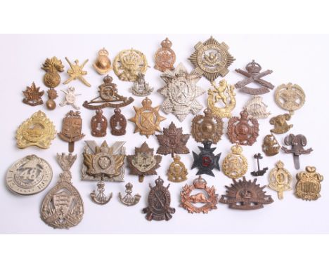 Selection of Colonial Cap Badges of various regiments and periods including Canadian The Perth Regiment, The Black Watch Roya