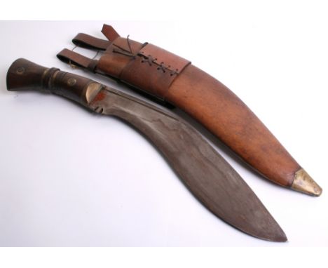 1917 Dated Gurkha Kukri complete with its original brown leather field service scabbard. Wood grip with brass work. Complete 